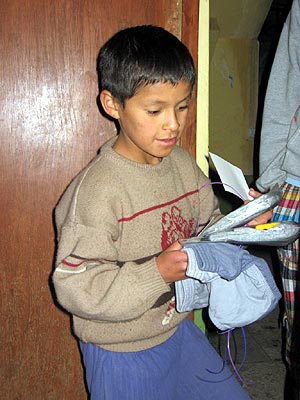 A new pair of pants and two new pairs of socks and underwear for each child