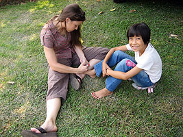 Sally Locket with a child in Thailand