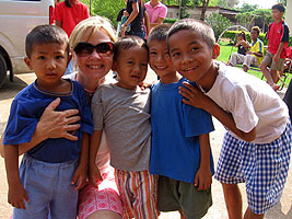 Katie Allred with a child in Thailand