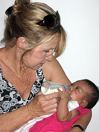 Katie Allred holding an orphaned baby