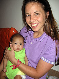 Sally Lockett Holding an orphaned baby