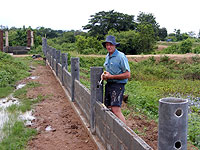 Fence being consturcted at children's village in Thailand