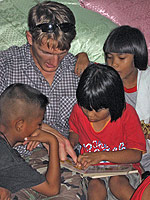 Sally and Casey Lockett visit orphans in Thailand